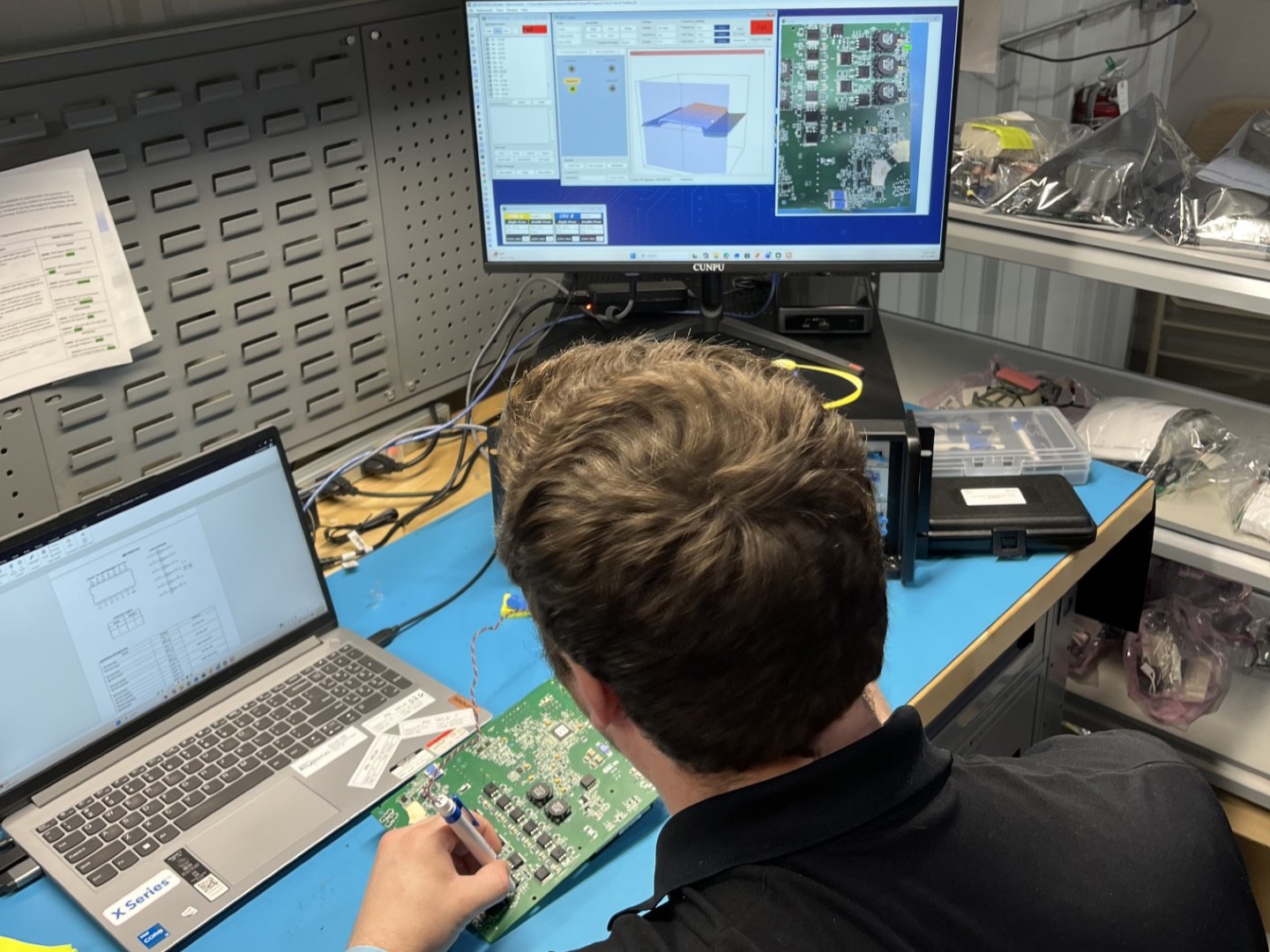 ReNew Biomedical Technician Diagnosing a PCB ReNew Biomedical Technician Diagnosing a PCB